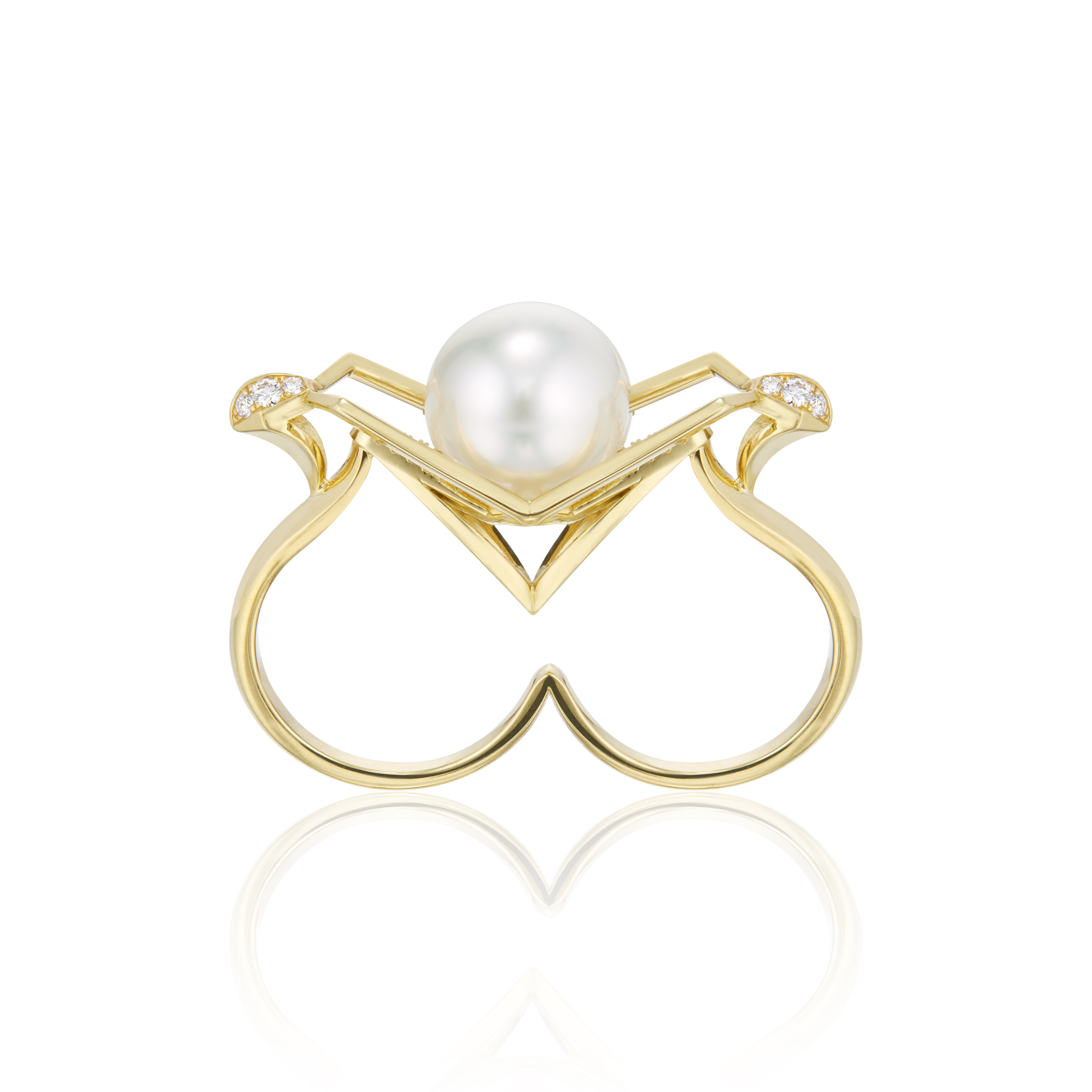 This is a frontal view of the Renisis Halo Lotus Double Ring. It's large pearl and dramatic and sharply angled triangular setting setting is is in full view. You can also see clearly the double ring designed for two adjacent fingers.
