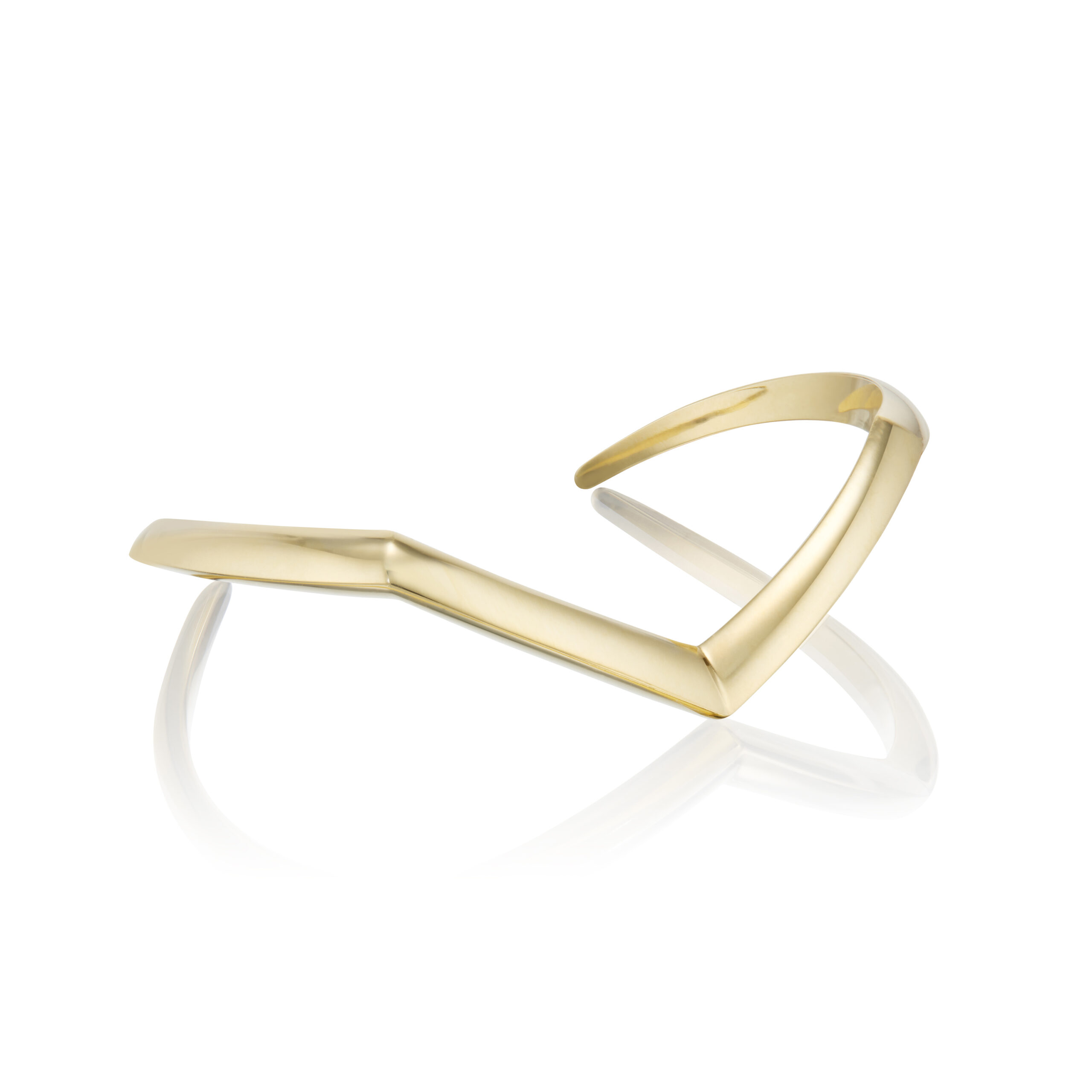 This a product photo of the Renisis Skywalk Single Wrist Cuff. It is crafted in 18k yellow gold and has a sharply bent shape.