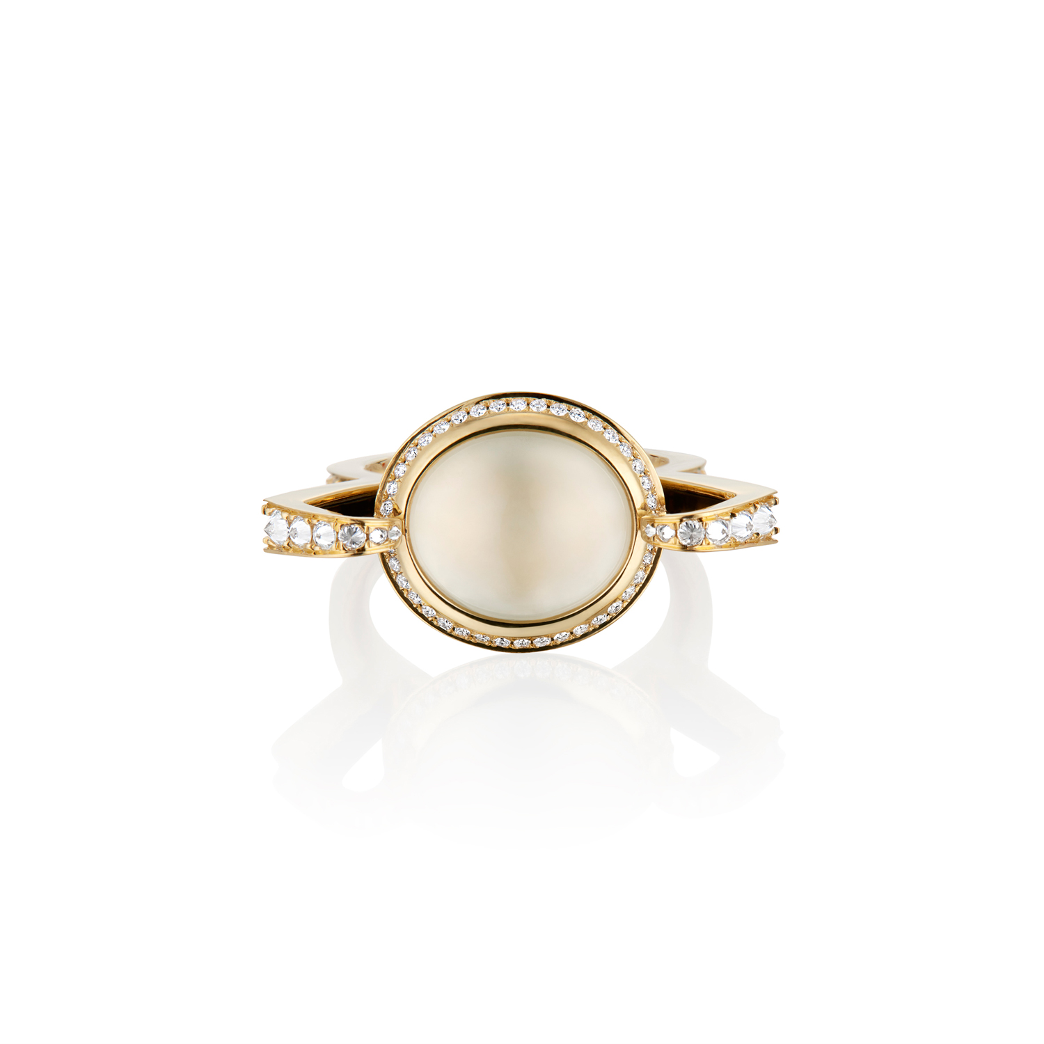 This is an overhead view of the Renisis Reservoir Ice Ring by artist Sardwell. It is crafted in 18k yellow gold with inverted diamonds and a translucent ice jade center. Its setting is high and dramatic.