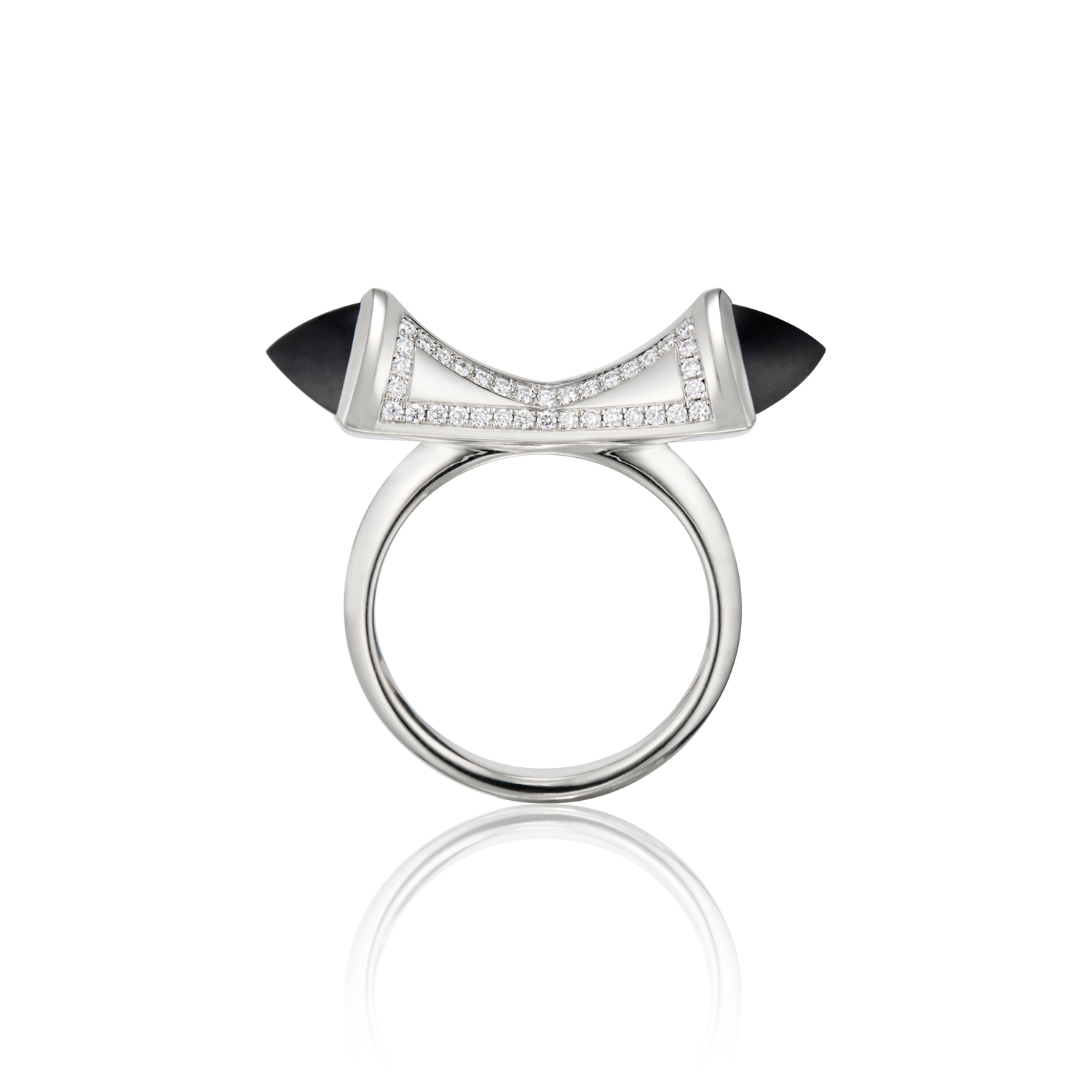 This is a front facing photo of the Renisis Black Jade Temple Bow Ring. It features18K white gold with black jade and diamond patterns. The sharply cut jade stones are set on opposite ends of the rings concave center.