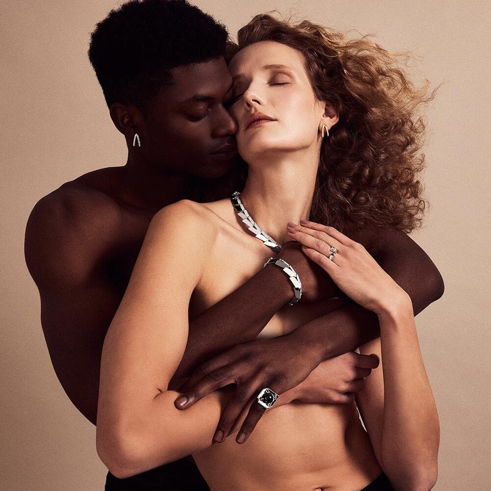 Photo of two models, a man and a women, modeling Renisis jewelry