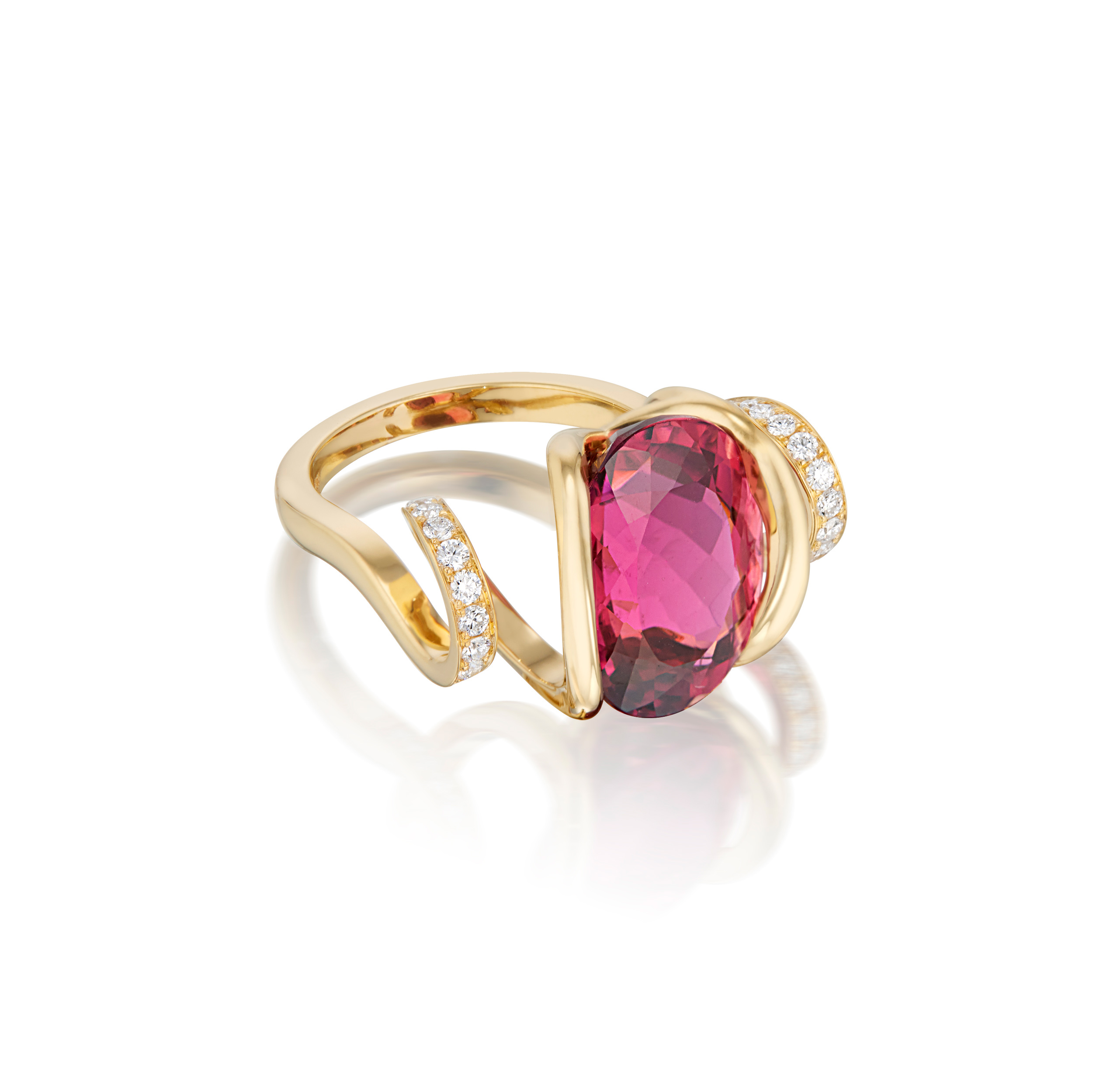 This is a 3/4 view of Renisis by Sardwell's Fire Curl Ring with pink tourmaline center and 18K yellow gold with pavé diamonds. You can clearly see the many facets in the pink gem stone. Its unique design featured a curled body and setting.